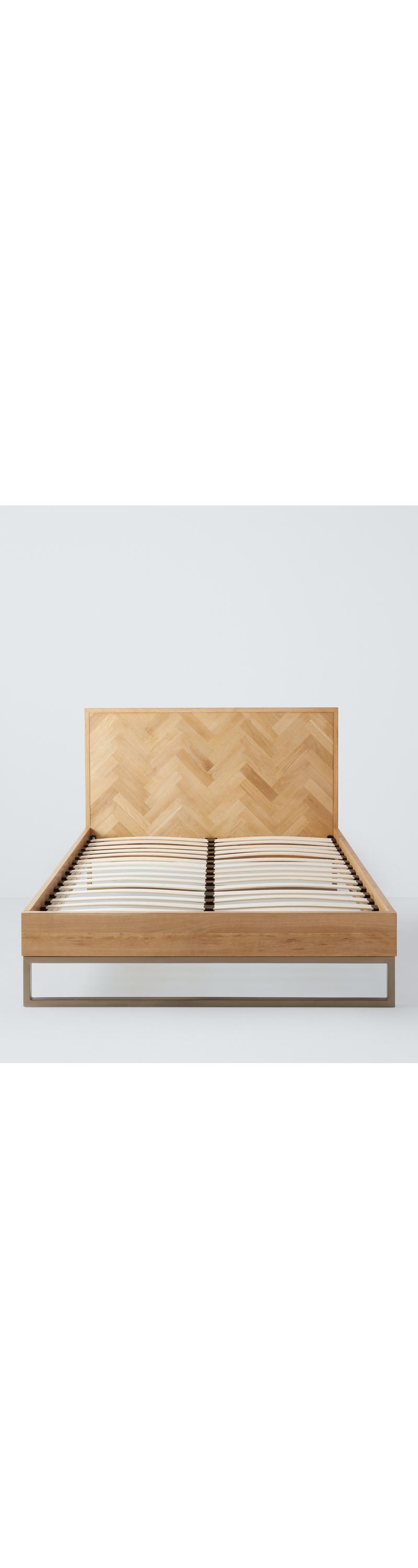 Bed base showing curved sprung slats and central support